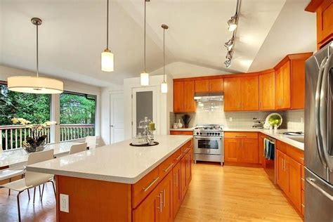 quartz countertops honey oak cabinets